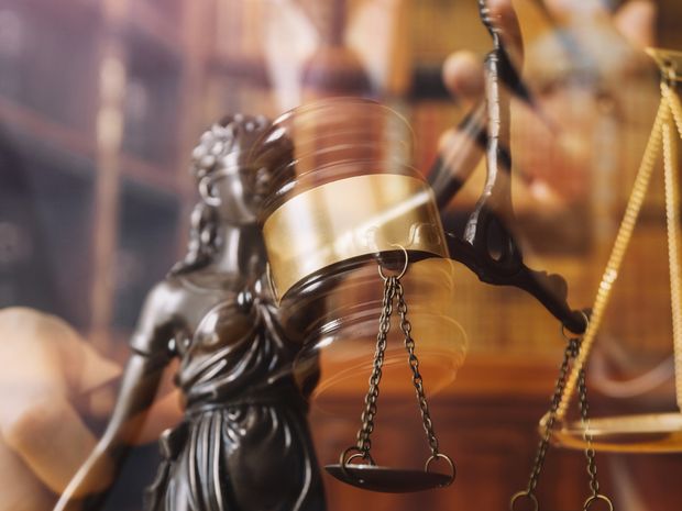 Scales of justice and gavel in a law office